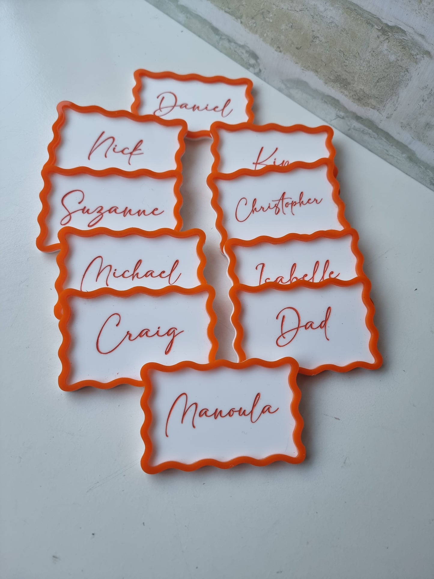 Wavy bordered name plaques