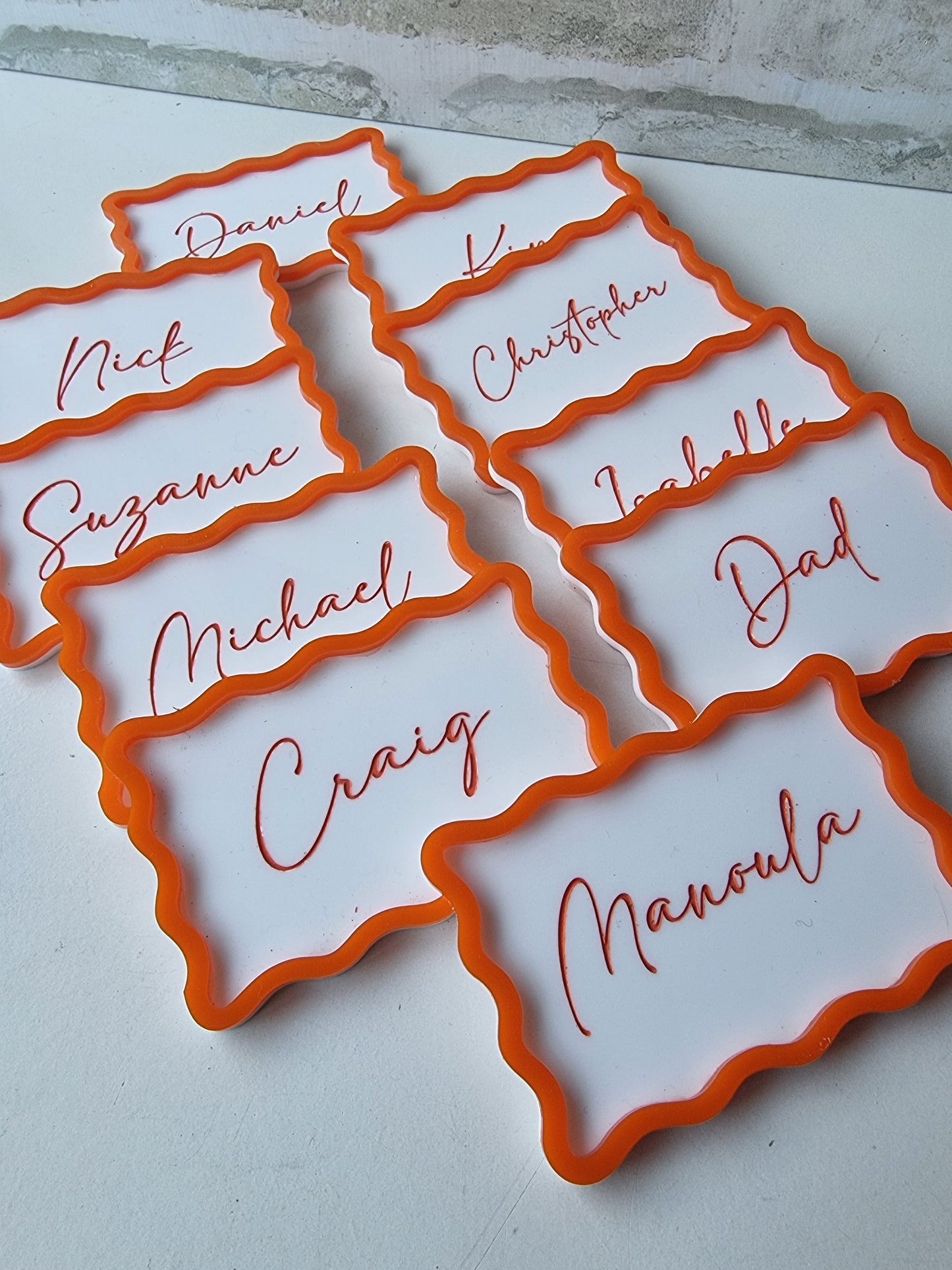 Wavy bordered name plaques